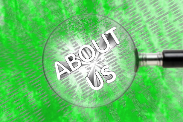 ABOUT US words through a magnifying glass on an abstract background.